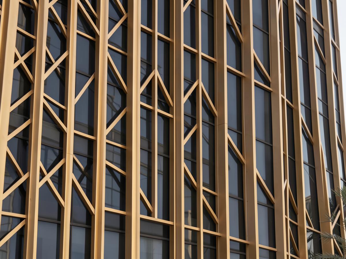 Detail of a gold louvred tower facade